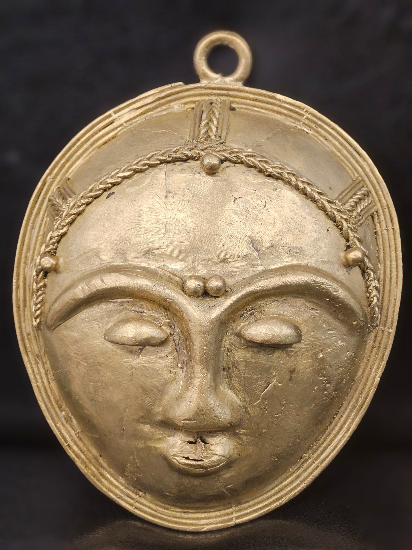 Front view of handcrafted African brass face mask wall art, 4.5 x 6 inches, traditional tribal design